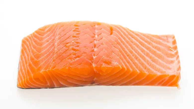 raw salmon filet white background