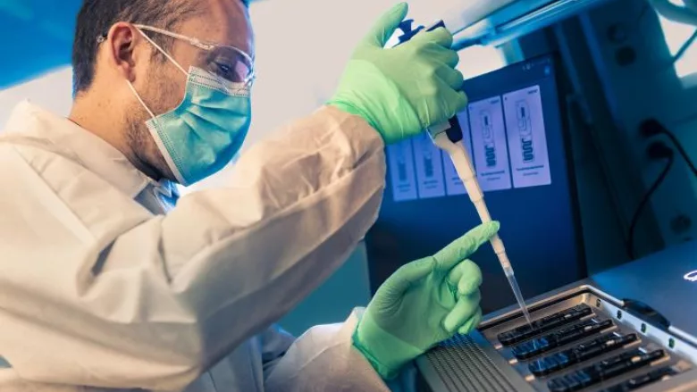 scientist preparing WGS instrument