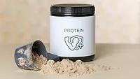 scoop and tub of protein powder scoop and tub of protein powder