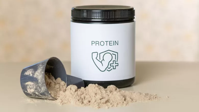scoop and tub of protein powder
