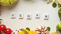 scrabble tiles spelling 'vegan'