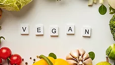 scrabble tiles spelling 'vegan'