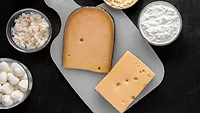 top-down view of various cheese dairy products on table top-down view of various cheese dairy products on table