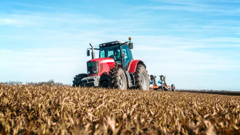 tractor harvesting field