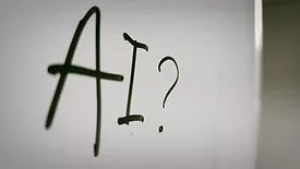 whiteboard that says 'AI'