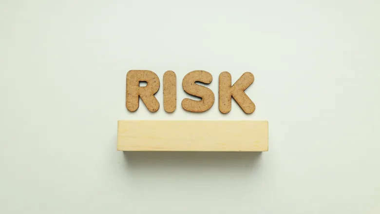 cork letters that say "risk"