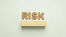 cork letters that say "risk"
