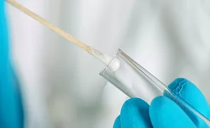 cotton swab going into tube