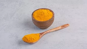 curcumin in wooden spoon and bowl_azerbaijan_stockers via Magnific.png curcumin in wooden spoon and bowl