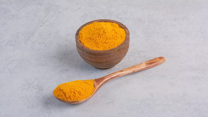 curcumin in wooden spoon and bowl_azerbaijan_stockers via Magnific.png curcumin in wooden spoon and bowl