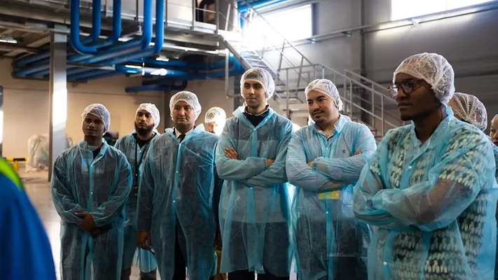 diverse group of people in protective clothing in food manufacturing plant_Jubayer Hossain via Pexels.png diverse group of people wearing protective clothing in food production plant