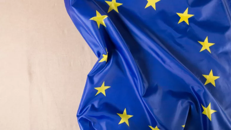 eu flag wrinkled laying on table