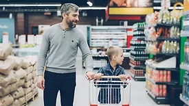 father and son grocery shopping