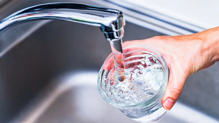 filling cup of water from the sink