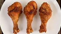 fried chicken drumsticks on a plate