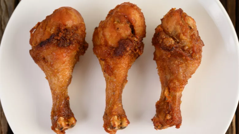 fried chicken drumsticks on a plate