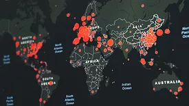 global outbreak hotspot notification map. red spots of various sizes at different locations on computerized map of the world
