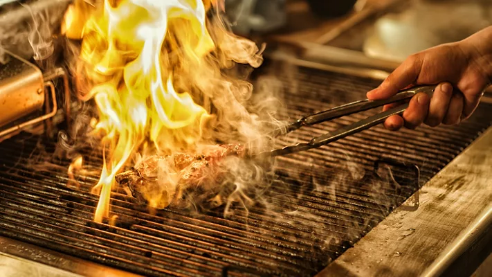 meat engulfed in flame on grill_ArtPhoto_studio via Magnific.png meat engulfed in flame on a grill