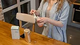 mother preparing bottle of infant formula_MART PRODUCTION via Pexels.png mother preparing bottle of infant formula