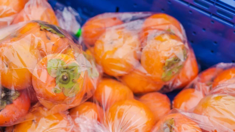 persimmons in plastic bags