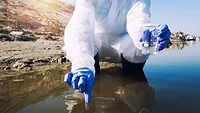 scientist collecting environmental water sample