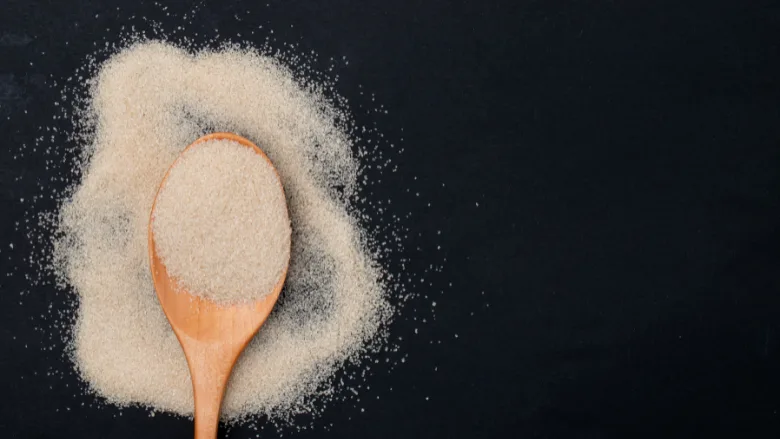spoon of whitish brown sweetener