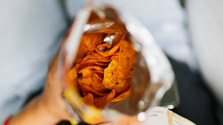top-down view of open bag of chips_kaboompics via Pexels.png top-down view of open bag of chips