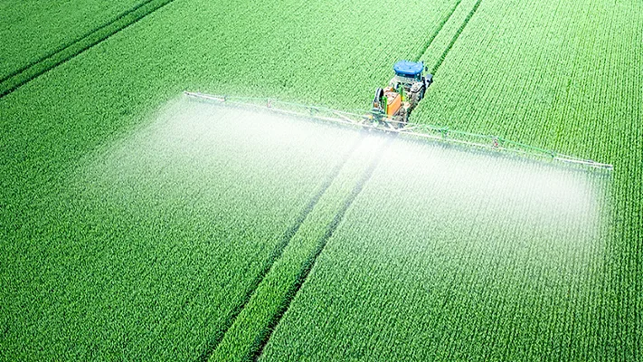 tractor spraying pesticides_MaYcaLiStock Getty Images Plus via Getty Images.png tractor spraying pesticides