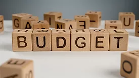 wooden blocks that spell "budget"