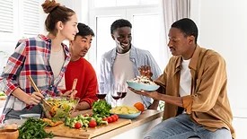 diverse friends eating meal together