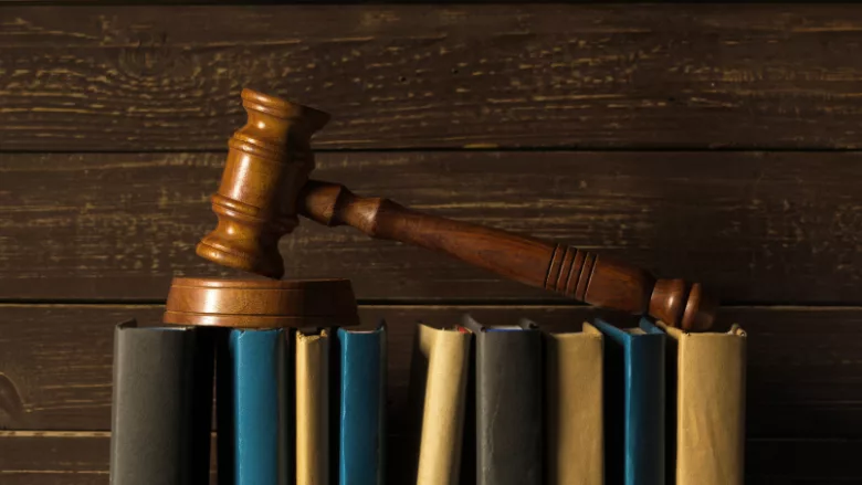 gavel on books wood background