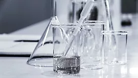 glass beakers with clear liquid