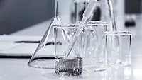 glass beakers with clear liquid