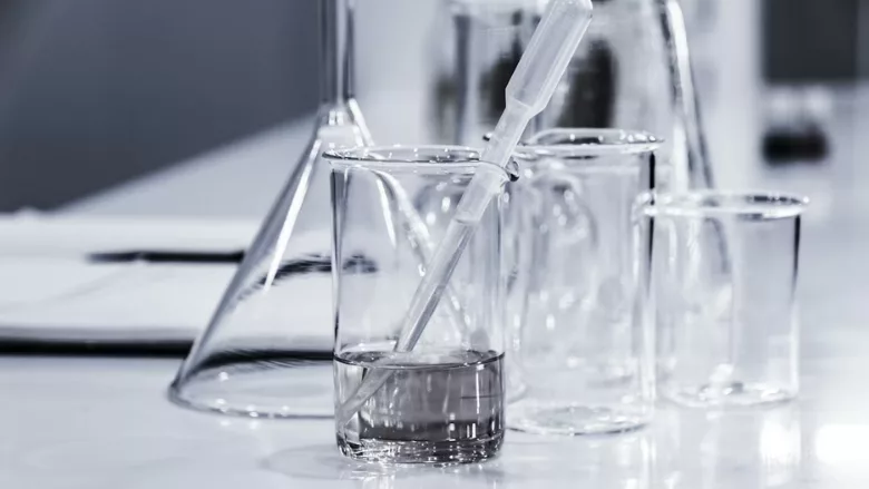 glass beakers with clear liquid