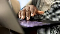 hand typing on laptop_DC Studio via Magnific.png hand typing on laptop