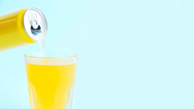 pouring yellow canned beverage
