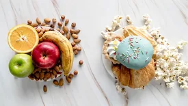 processed snacks next to fruit and nuts