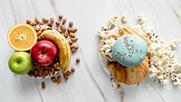 processed snacks next to fruit and nuts