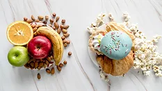 processed snacks next to fruit and nuts