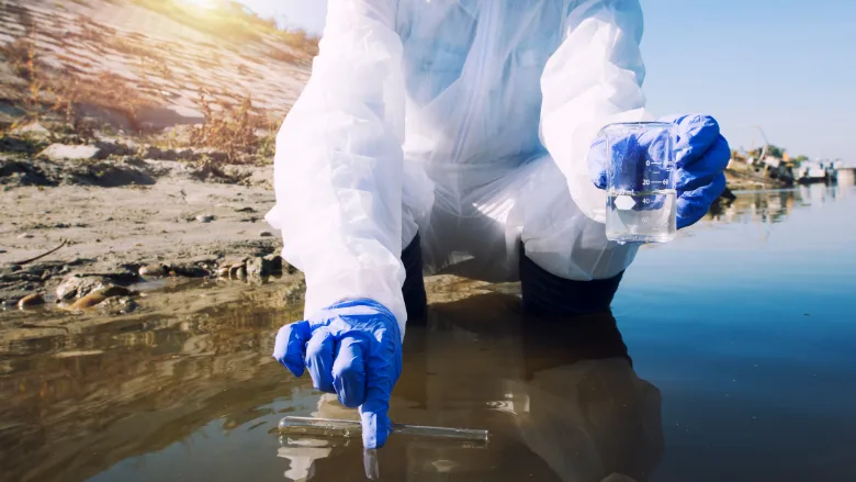 scientist taking water sample
