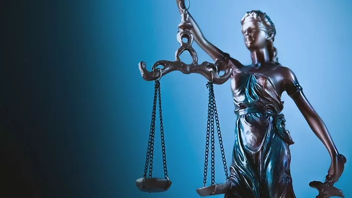 statue of justice with scales of justice