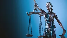 statue of justice with scales of justice