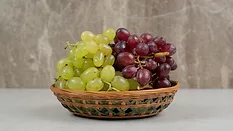 red and green grapes in basket
