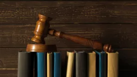 gavel on books wood background