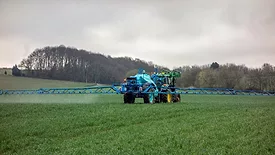 tractor pesticide application in field