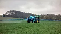 tractor pesticide application in field