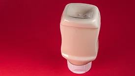whitish sauce in a bottle