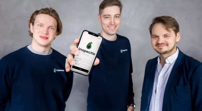 three people holding phone that says inspectle food