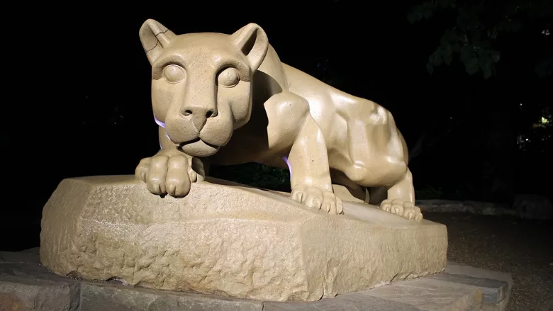PSU nittany lion statue at night