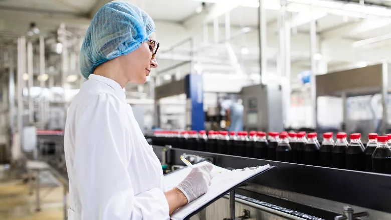 foodlube woman examining food line
